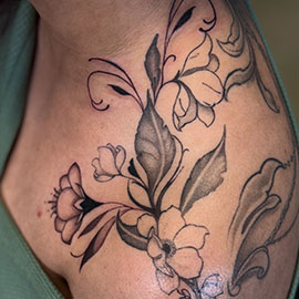 Custom delicate flowers on shoulder, blackwork fineline design by sheila.tattoos Black Pearl Tattoo Santa Cruz CA